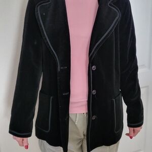 Vintage black velvet jacket. Great condition. No rips or tears.